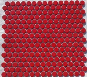 A red coloured round, penny mosaic porcelain tile.