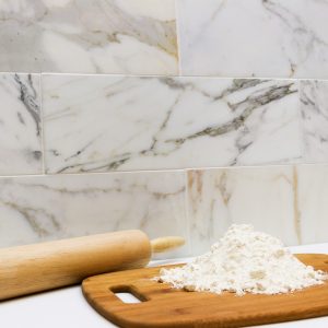 A marble tile. The Calacatta Gold is a subway tile best used as a wall tile in bathrooms and kitchens.