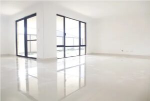 Porcelain tiles are very versatile and are not just used in bathrooms. This image shows beautiful porcelain floor tiles in main living room of a home.