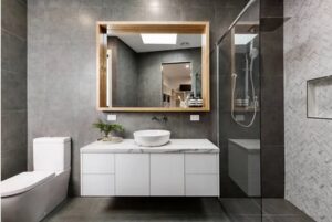 A bathroom with beautiful dark marble toned tiles